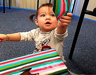 a child opening a gift at Make it Take it